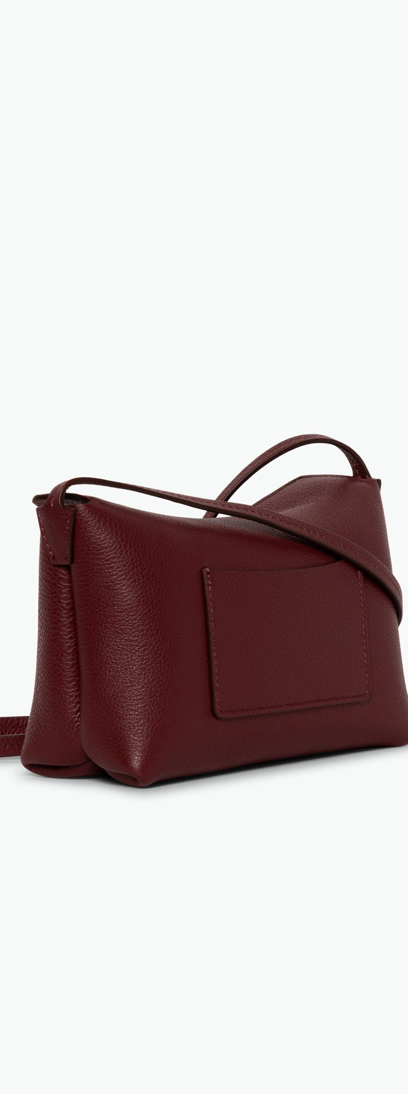 Wandler Penelope Slouch Mini in the color Acai, made from  Italian calf leather with golden hardware and slim adjustable strap, backside view.