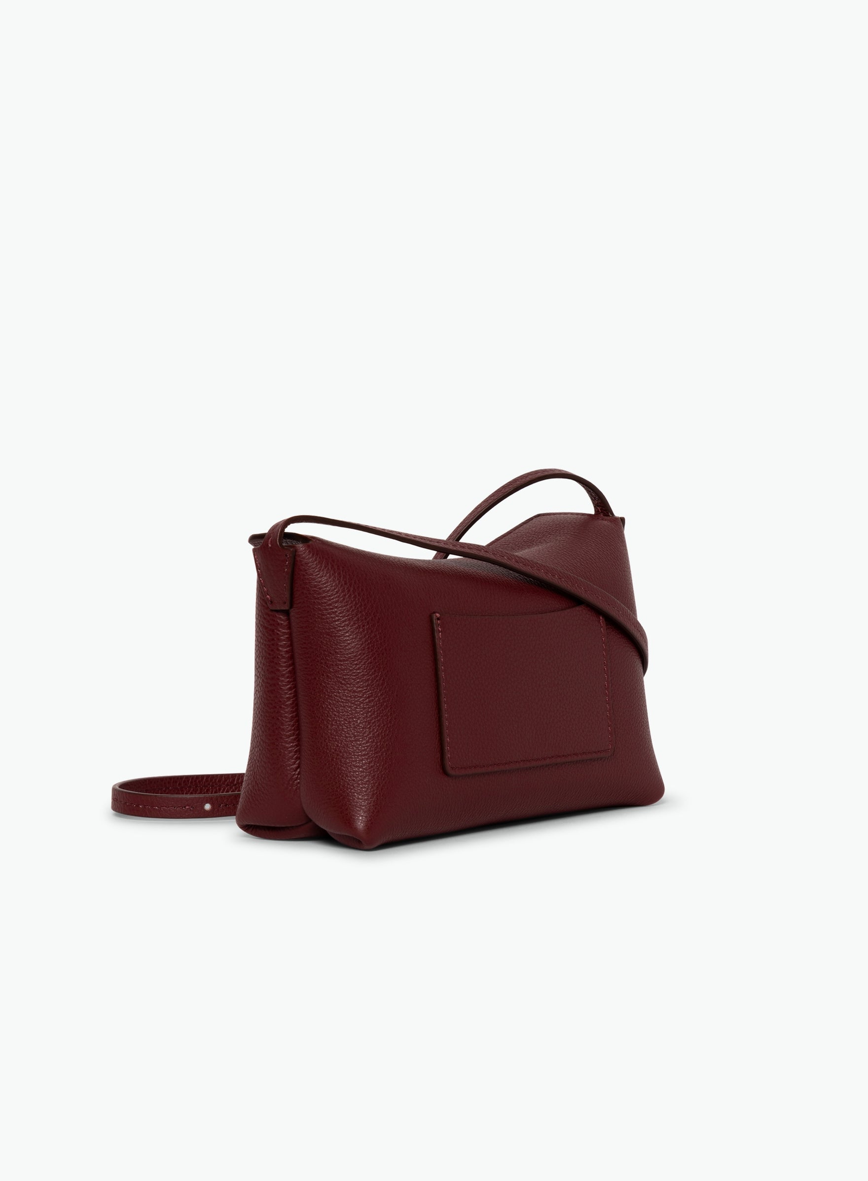 Wandler Penelope Slouch Mini in the color Acai, made from  Italian calf leather with golden hardware and slim adjustable strap, backside view.
