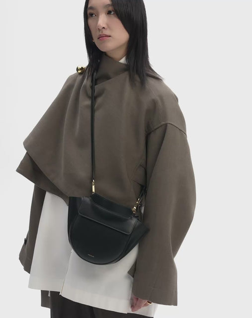 Video showcasing the Hortensia Bag Mini in the color black. Bag is shown on model, worn in a crossbody style.